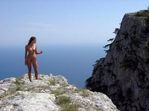 Bare young woman model in climb on